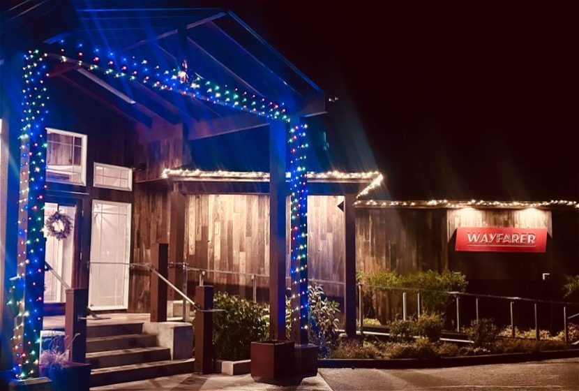 Wayfarer Restaurant exterior at night lit up with Christmas lights